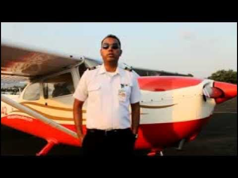 Avestar-guided pilot standing in front of a training aircraft